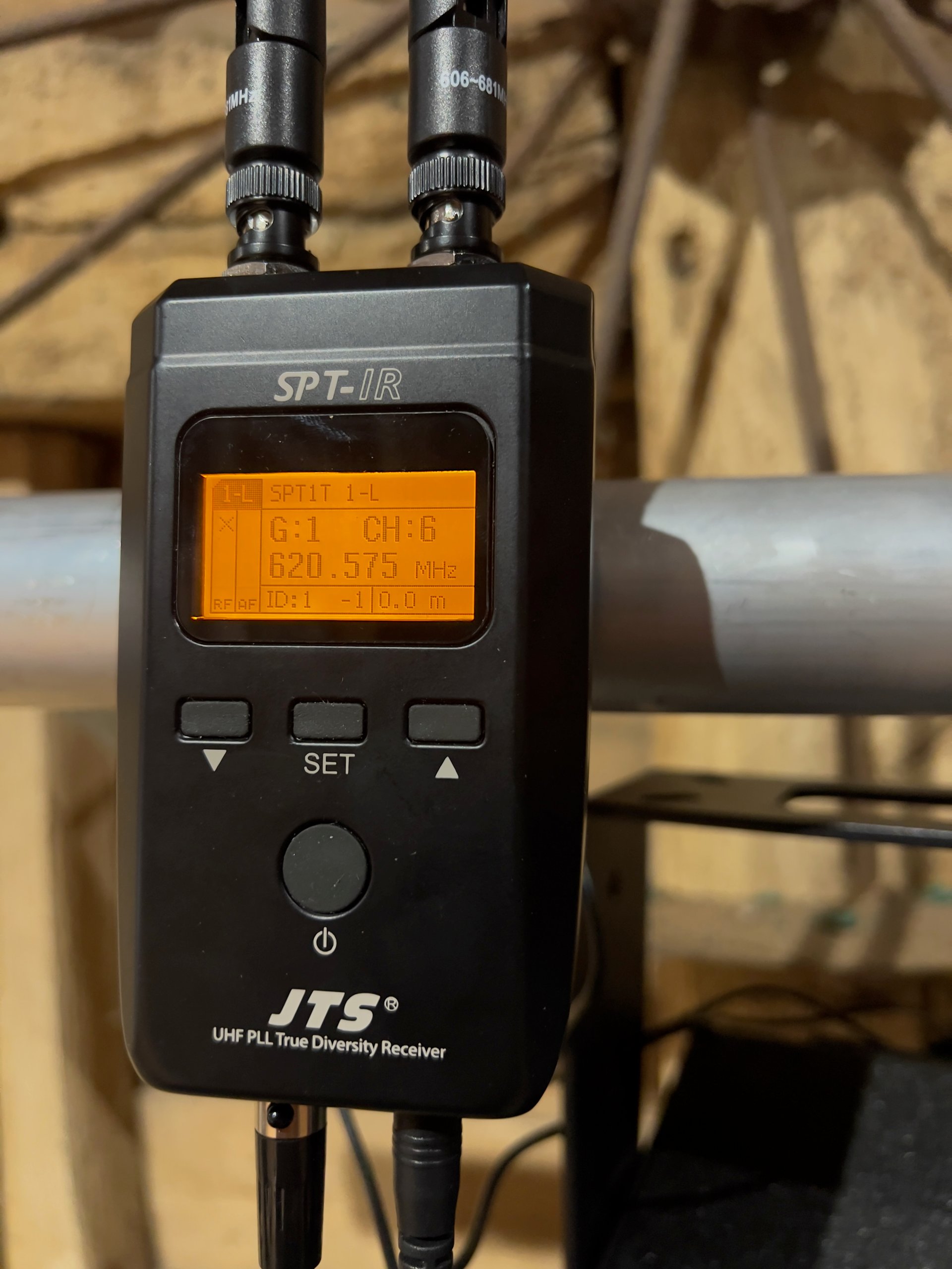 UHF PLL true diversity receiver displaying frequency settings for professional AV event sound management.