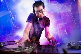 DJ mixing tracks at an event with vibrant lighting effects and professional sound equipment.