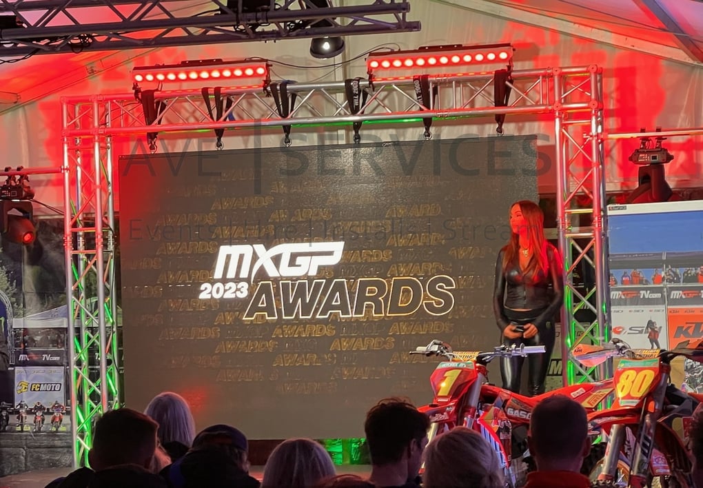MXGP 2023 Awards stage setup with lighting, truss structures, and sound equipment at a motorsport event.