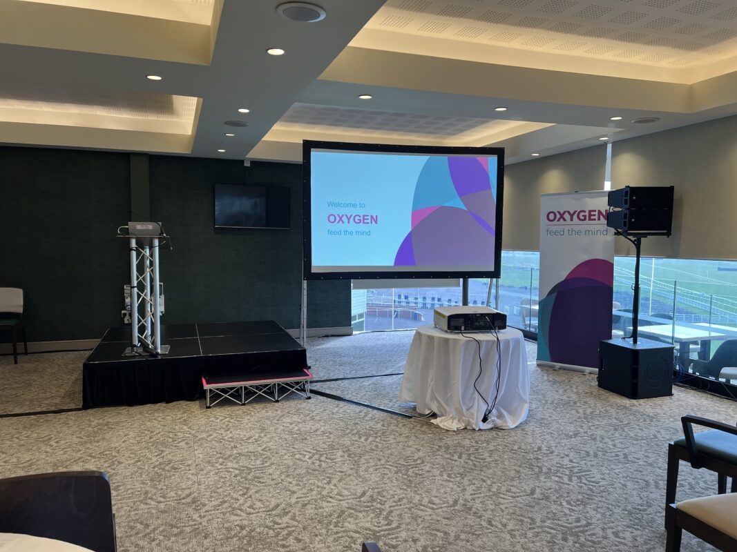 Newbury Racecourse event space, large conference for an annual event. Speakers, microphones, relay screens, large projection screen, technician. Multi-day event