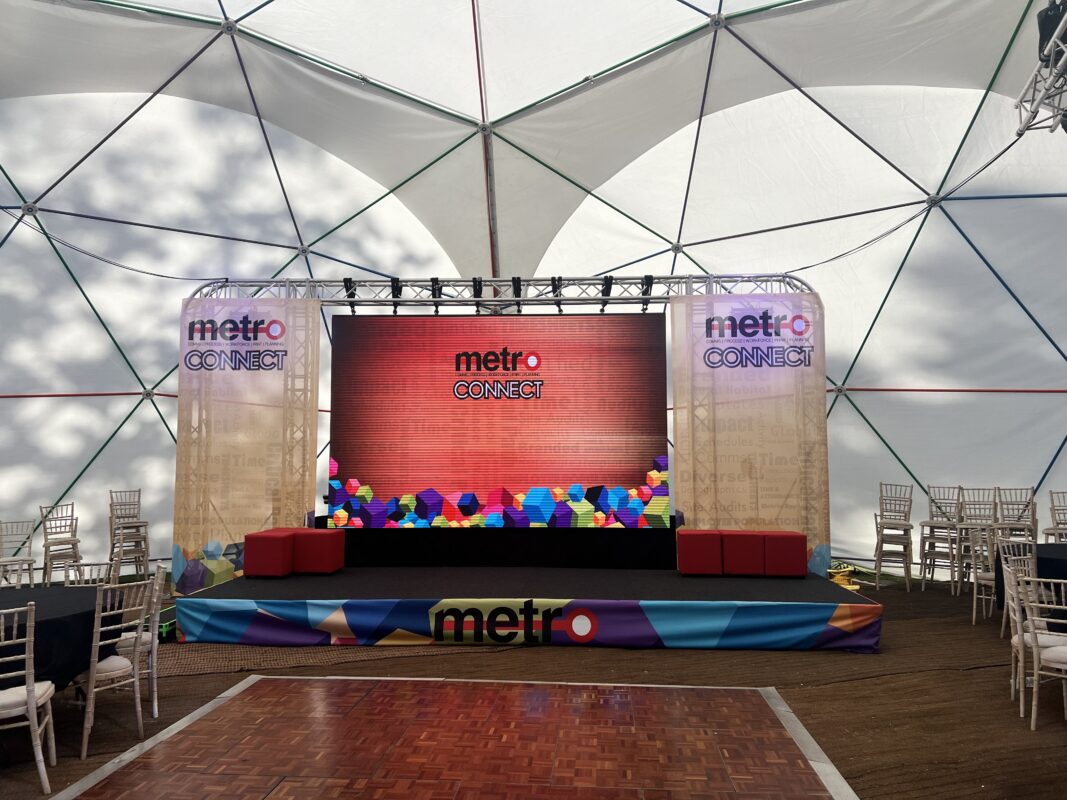 Metro Connect, New Forest, Customer event, event, conference, LED Videowall, LED, Printed graphics, staging, lighting, lectern, technicians, wireless microphones, pa system, multiple rooms, speakers, truss, large screen, laptops, AVE Services, audio visual equipment, av, av supplier