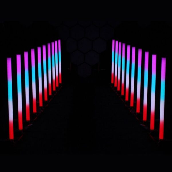 Colorful LED uplighting creates a vibrant entrance walkway for an event, featuring red, blue, and pink hues.
