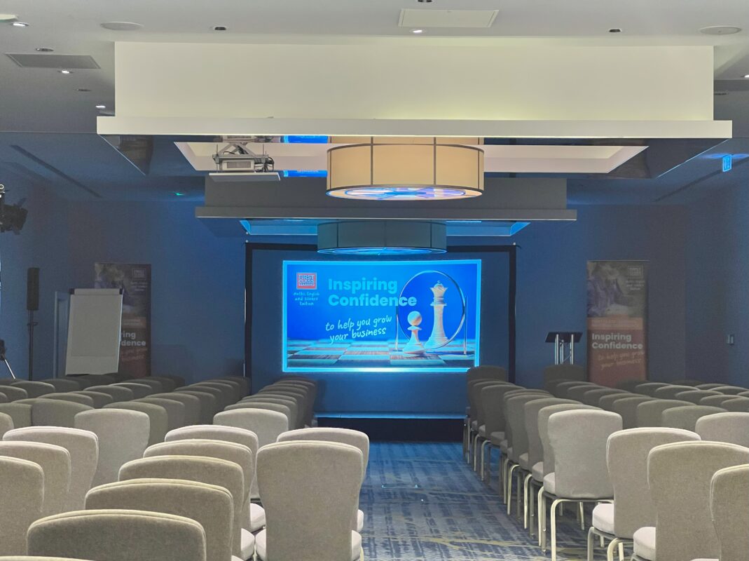 Conference, Events, Buckinghamshire, AV hire, Audio Visual, PA system, wireless microphones, speakers, projectors, screens, lens, projector screens, technicians, lights, awards, large audience, large screens, AVE services