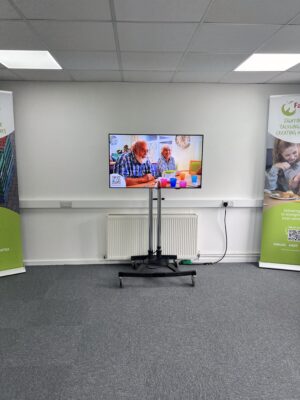 New warehouse opening, 50" display with branded video playing on loop